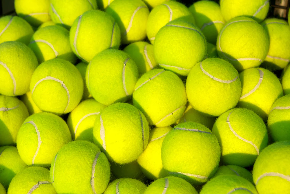 Standard yellow tennis balls for advanced competitors